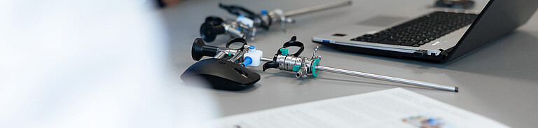 Photo of a medical endoscope by Henke Sass Wolf on a desk.