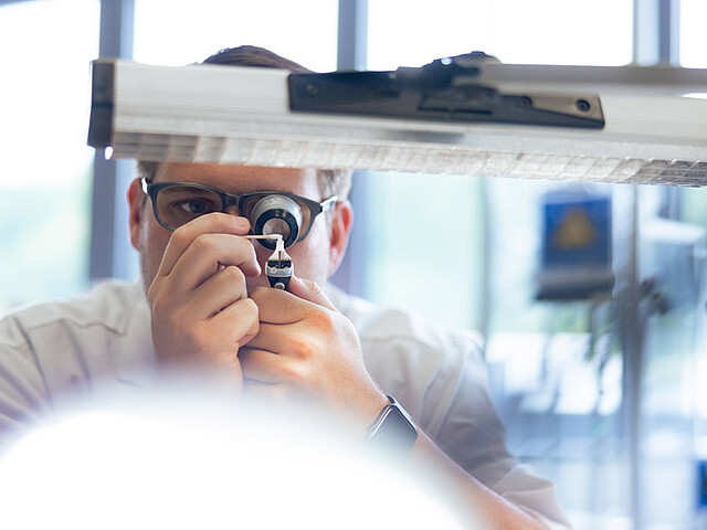 Sight camera systems Henke Sass Wolf Photo of an employee who dosen't lose the sight with camera systems by Henke Sass Wolf.