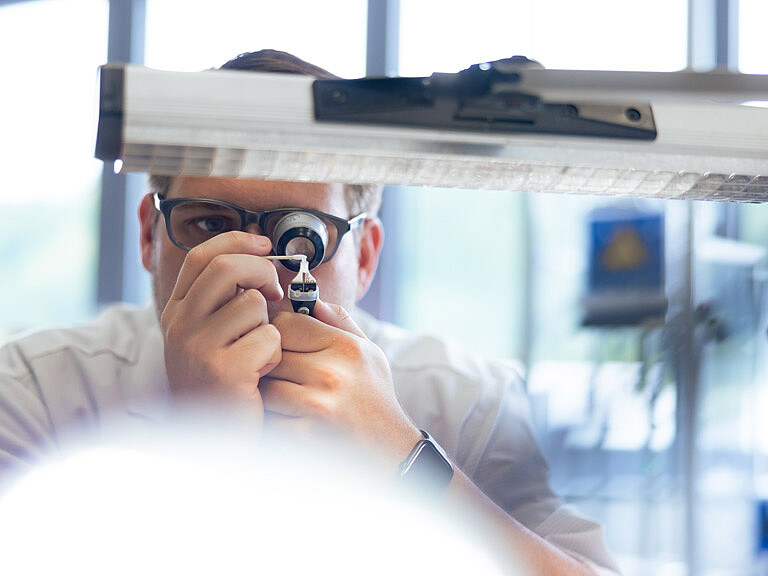 Sight camera systems Henke Sass Wolf Photo of an employee who dosen't lose the sight with camera systems by Henke Sass Wolf.